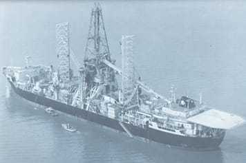 A black and white photograph of the Hughes Glomar Explorer ship in the water.