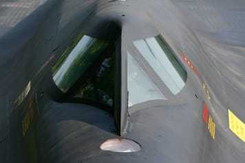 The slanted cockpit windows of an 12-Oxcart.